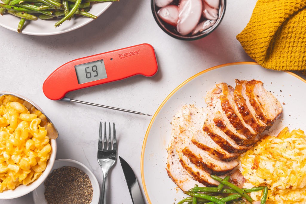 Delicious meal of smoked turkey and sides, with a Thermapen ONE beside