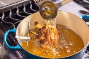 bathing the pata in hot oil