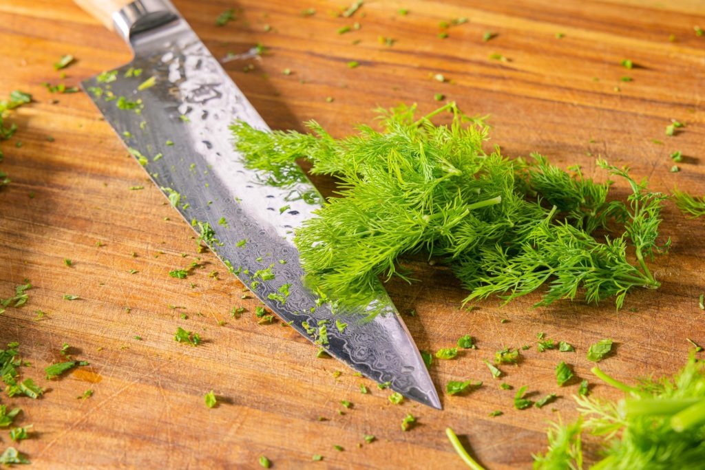Knife with fresh dill