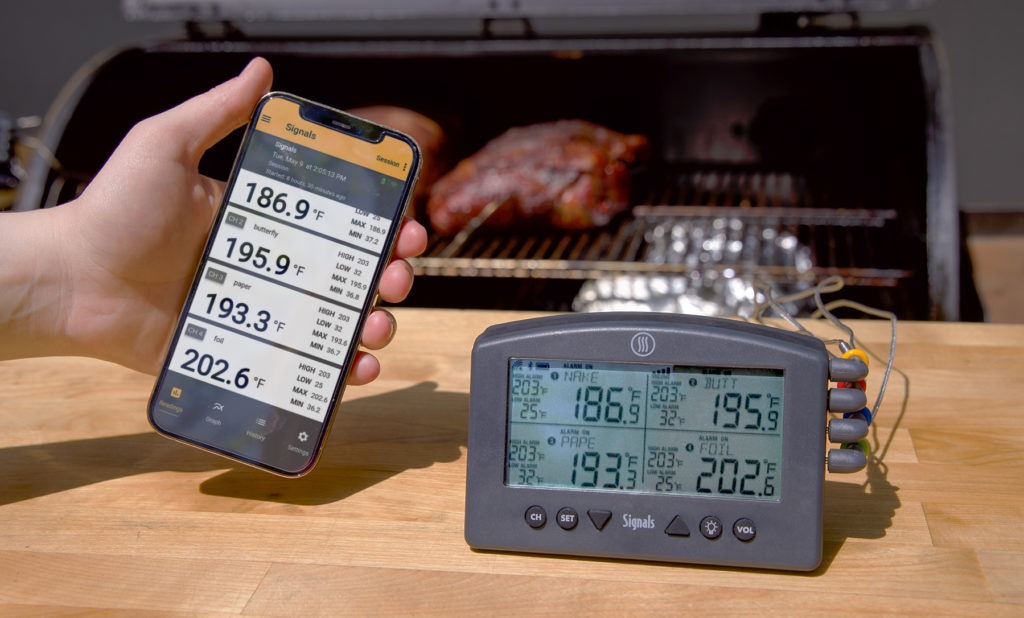 phone and thermometer cooking pork butts