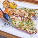 buttering grilled lobster tails
