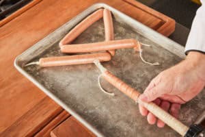Linking the sausages and stuffing them