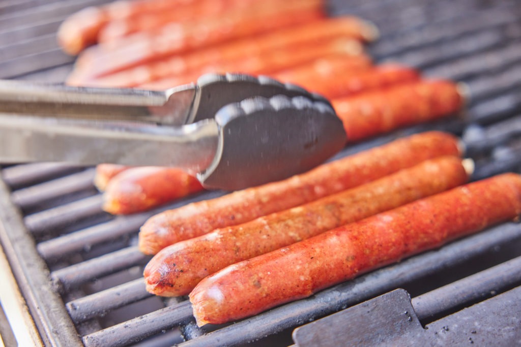 hotdogs on a grill