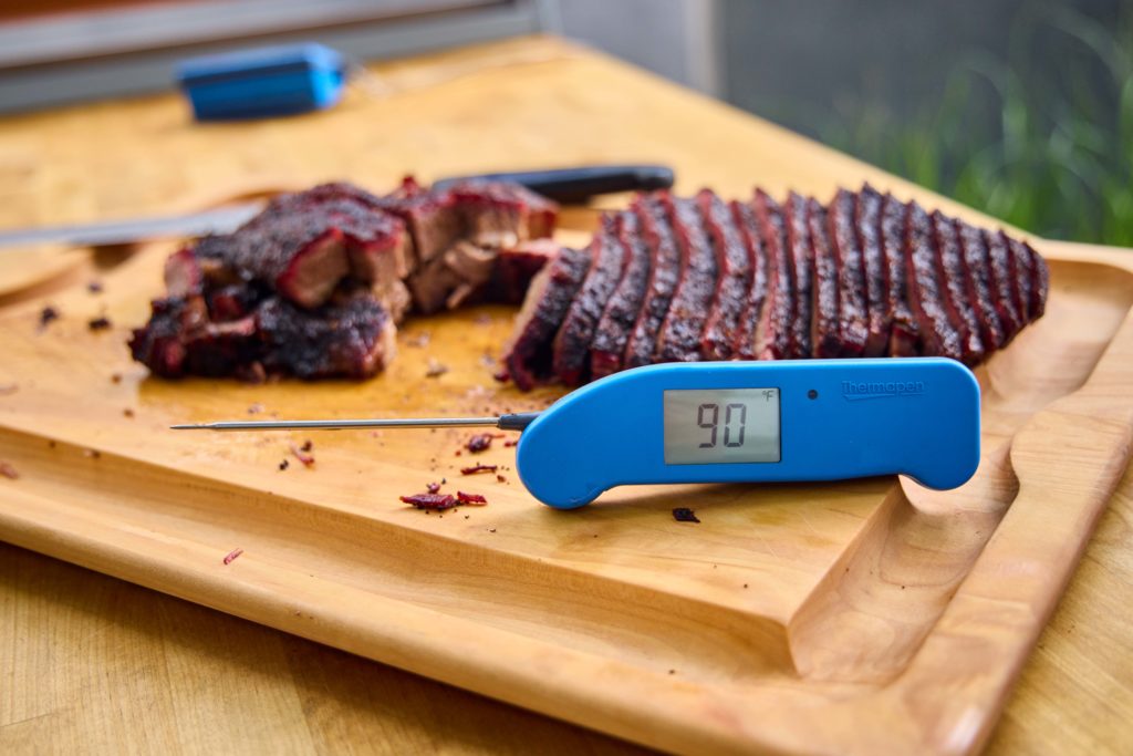 Thermapen ONE sitting in front of a brisket