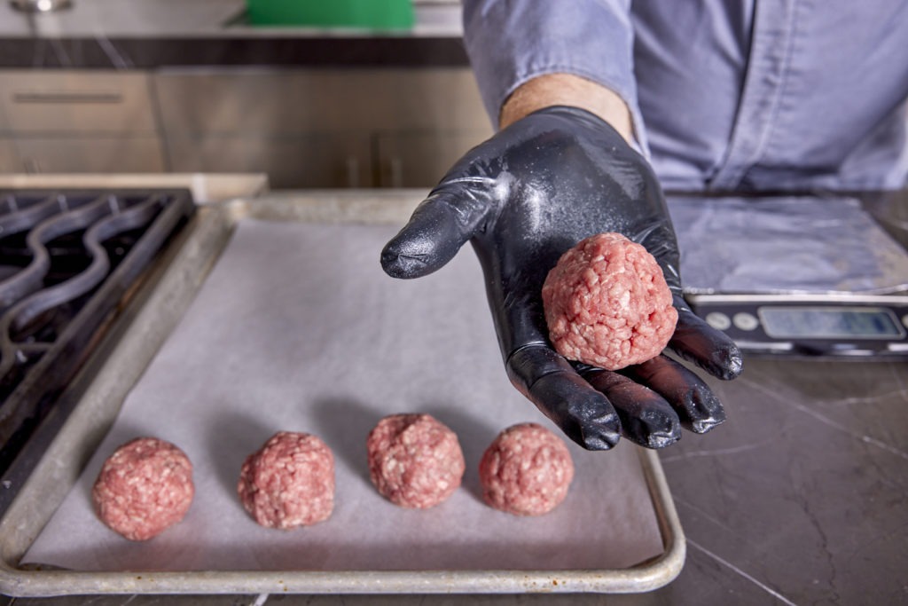 Rolling the meat into 2-oz balls