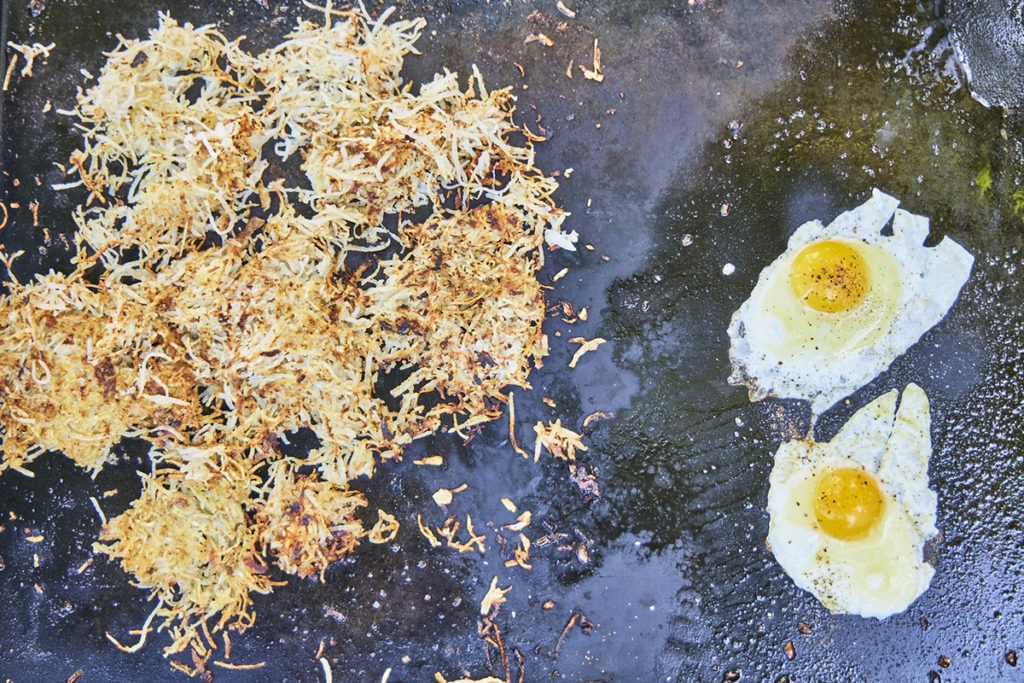 Hashbrowns and eggs on the griddle