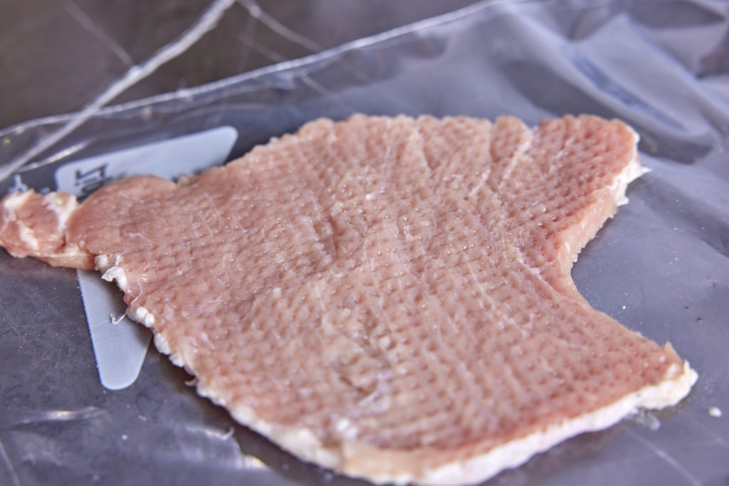 A flattened, textured pork cutlet