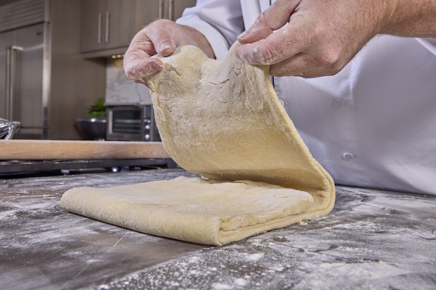folding the dough back in on itself
