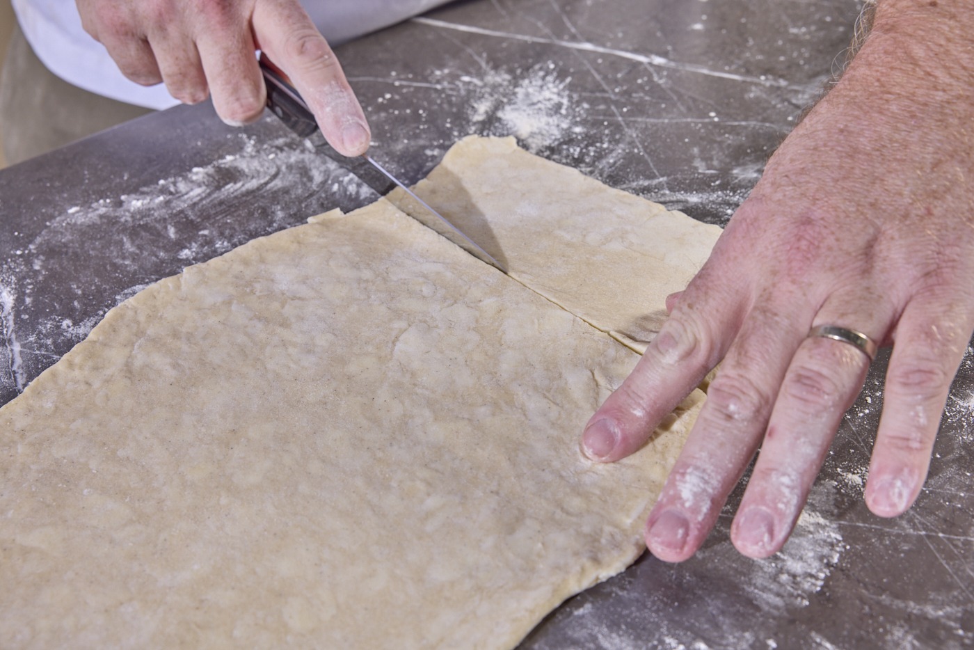 cutting the dough into squares