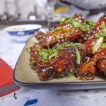 Sticky wings with all their garnishes