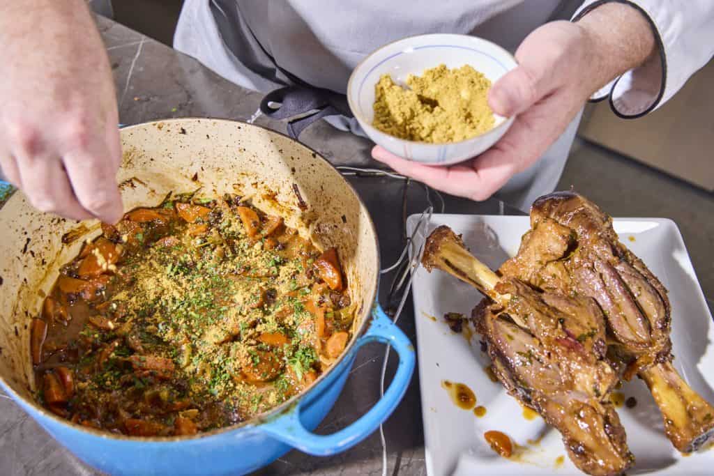 stirring the pistachio powder into the braise