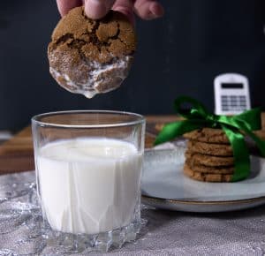 dipping a ginger cookie in milk