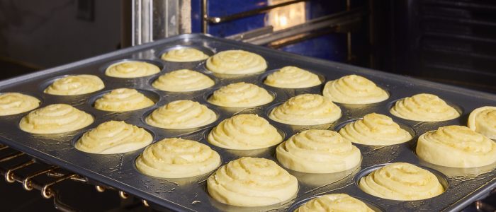 Proofed rolls going into the oven