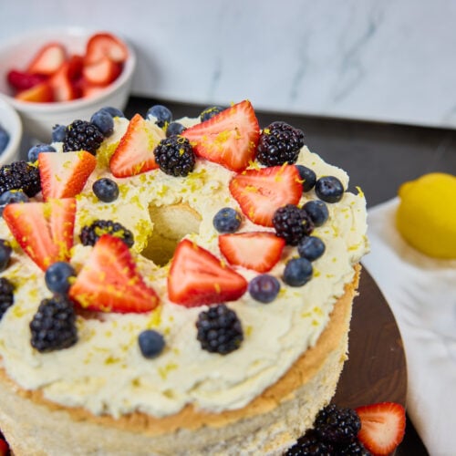 photo is of finished cake with berries on top.