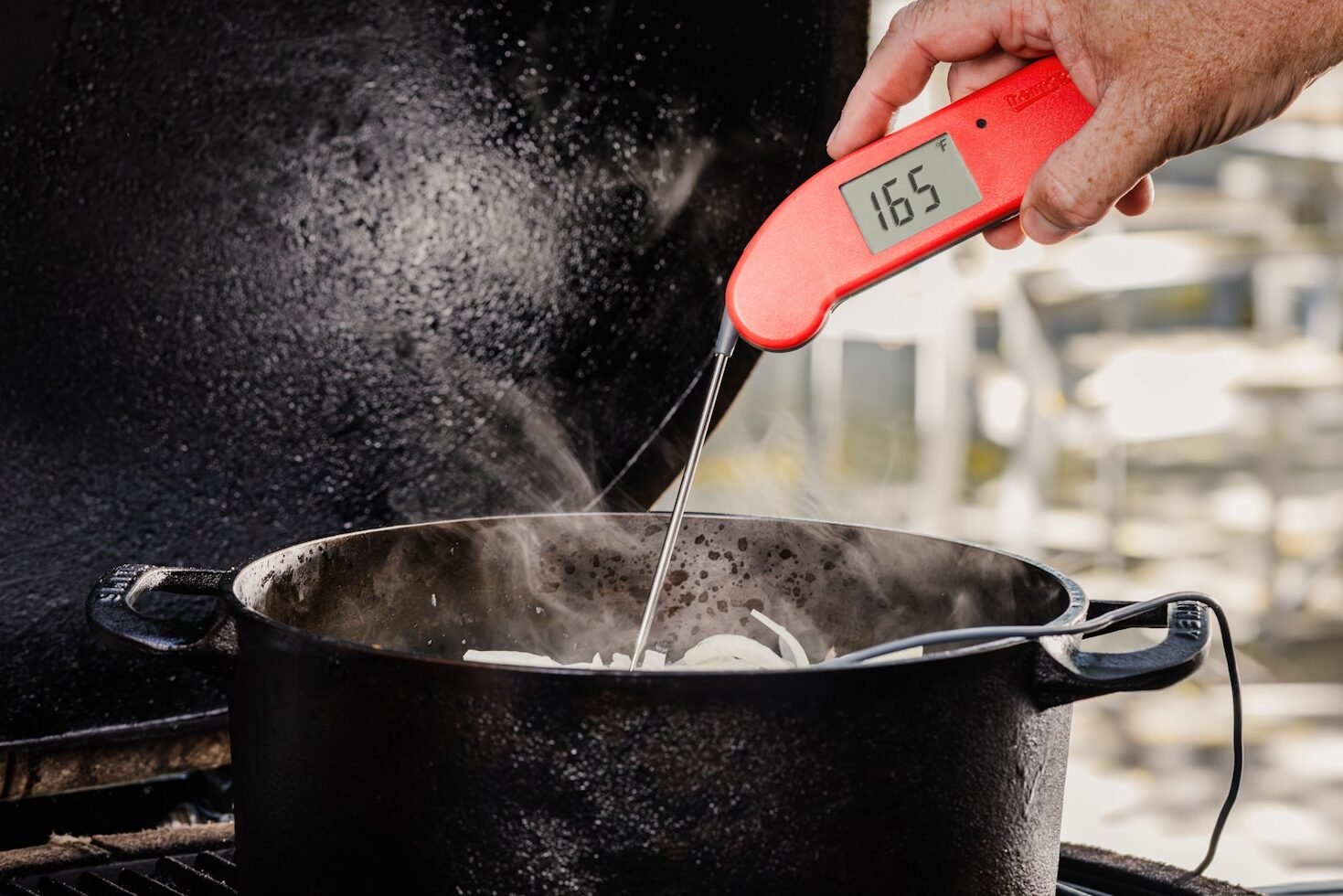 Verifying the temp of the brats with Thermapen ONE