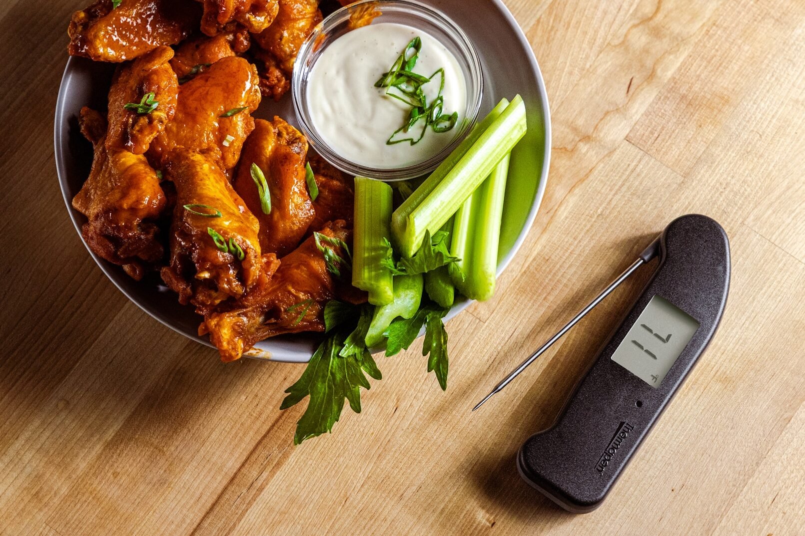 Wings in a bowl, celery, dressing, Thermapen